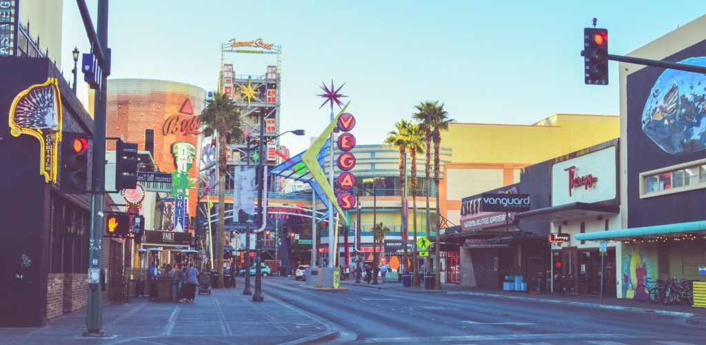Picture of downtown Las Vegas during the day, big signs, looking in on fremont street.